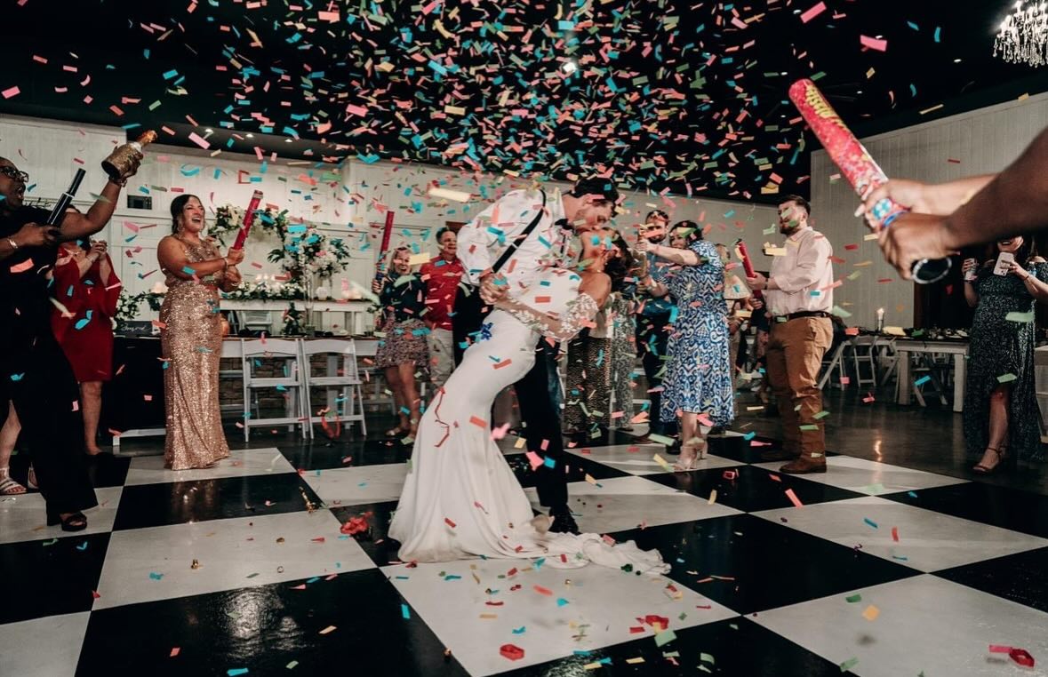 Guests celebrating in the custom decorated Show Barn space