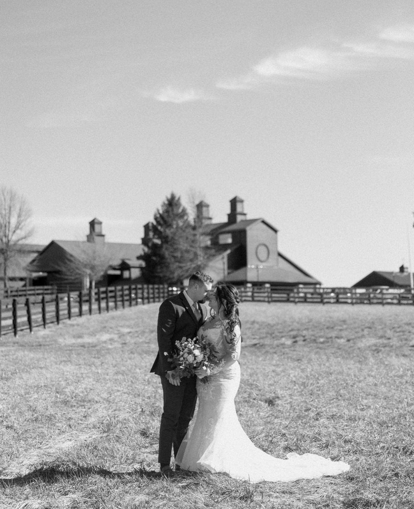 Bride and groom sharing a first dance inside The Show Barn
